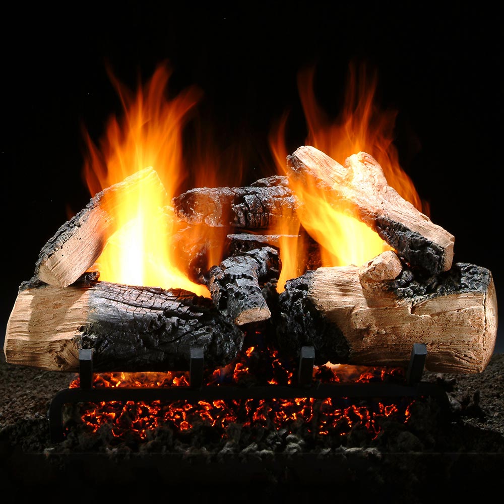 Gas log set with vented logs burning with bright yellow and orange flames