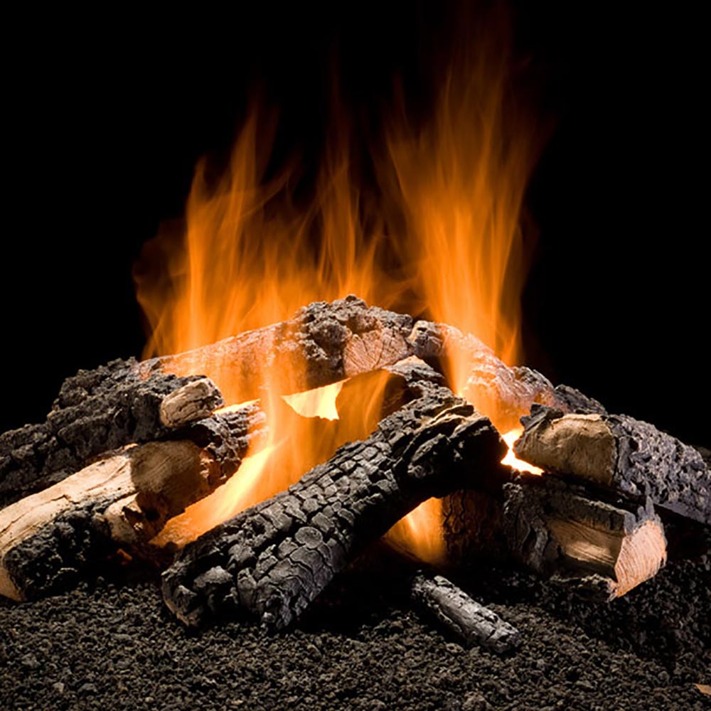 Gas log set with charred logs and active orange flames