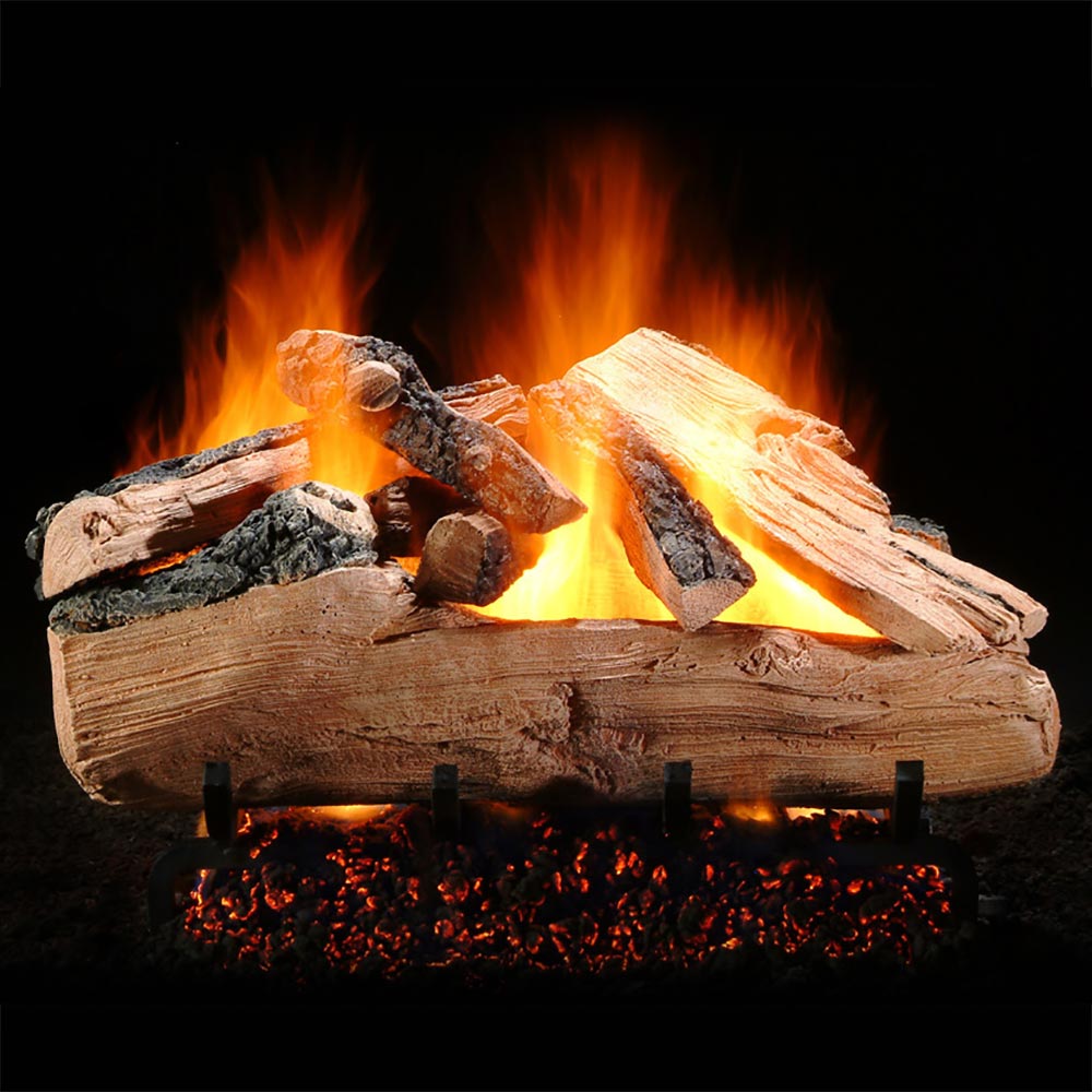 Vented gas log set with stacked logs and glowing orange flames in firebox