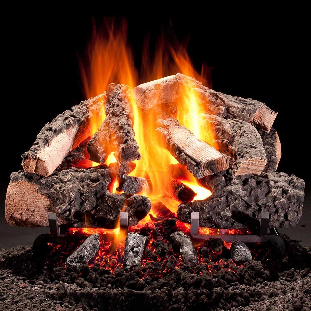 Vented gas log set with glowing charred logs and bright orange flames