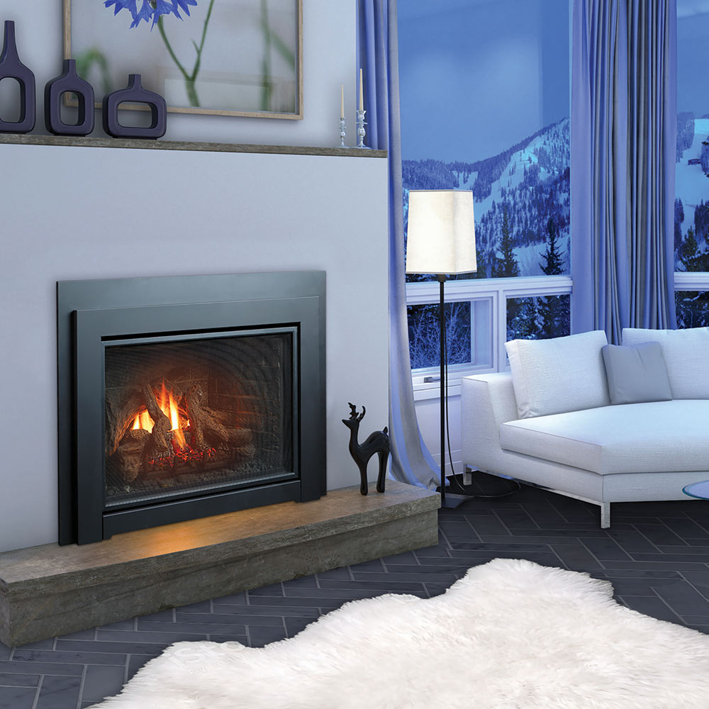 Gas fireplace insert with black frame and lit flames behind glass