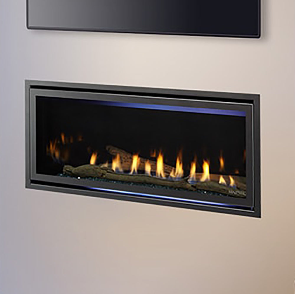 Direct vent gas fireplace close-up with glowing burner flames behind glass