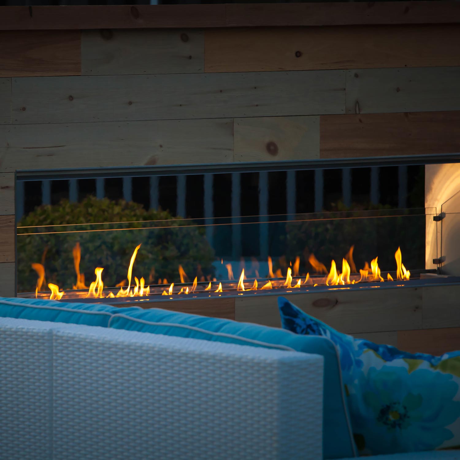 Outdoor fireplace conversion kit insert with visible burner flames