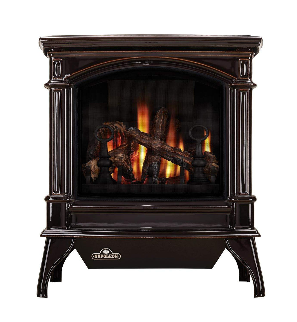 Dark cast iron gas stove with arched glass firebox and burning logs