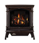 Dark cast iron gas stove with arched glass firebox and burning logs
