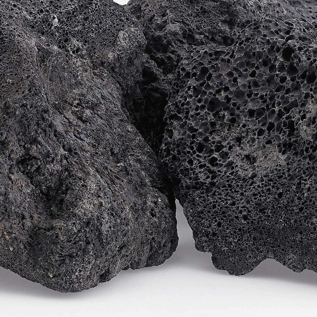 Black lava rock close-up showing rough porous cavity texture
