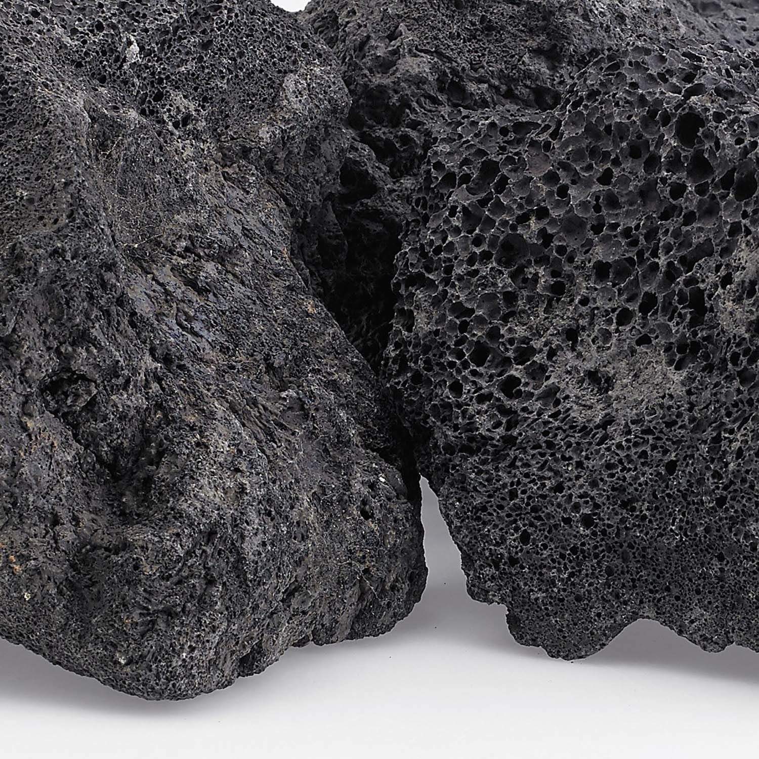 Black lava rock close-up showing rough porous cavity texture