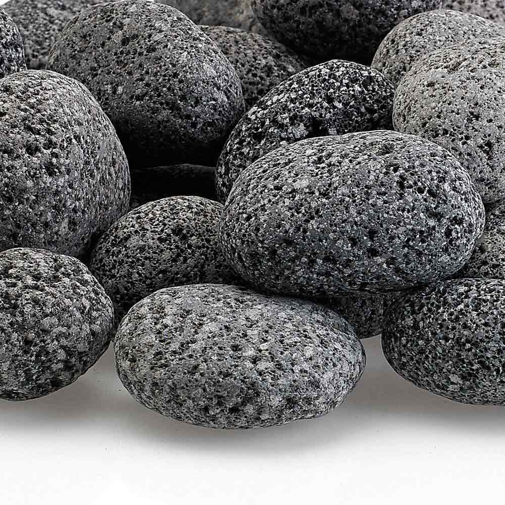 Gray lava stones close-up, rounded pebbles with rough speckled surface