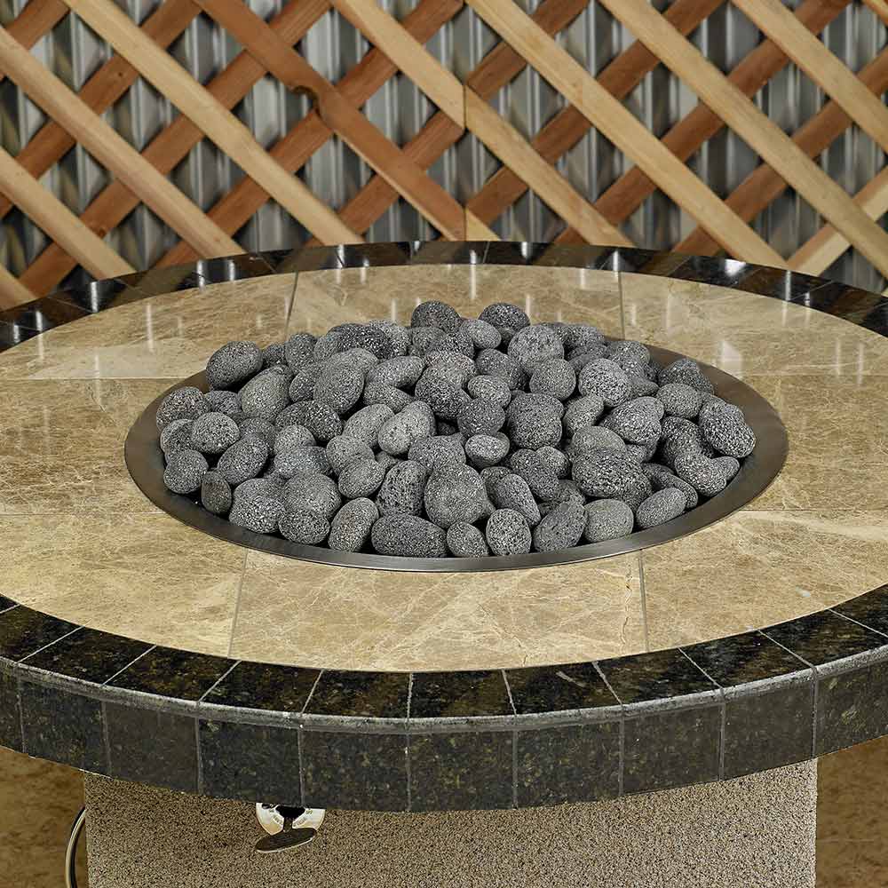 Gray lava fire glass stones in round metal fire pit bowl