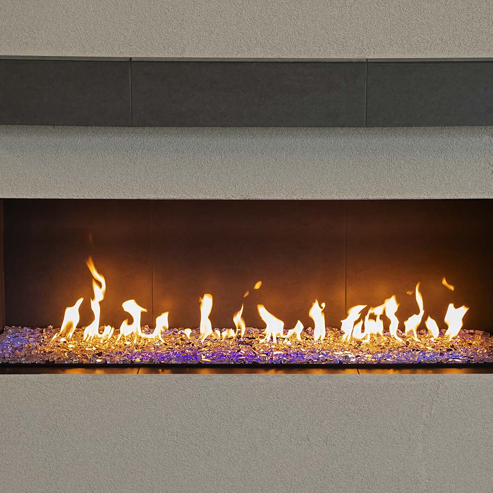 Linear gas burner with flame bed and purple LED accent lighting