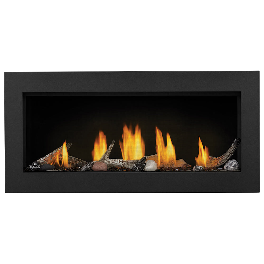 Black gas fireplace with glowing flames and decorative log pieces inside a rectangular frame