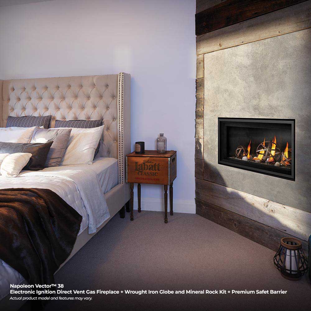 Wall-mounted linear gas fireplace with black frame and burning flames in a living room