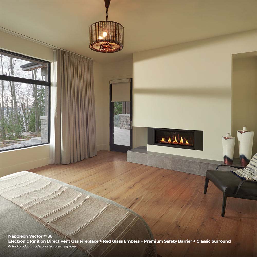 Modern living room with black-framed linear gas fireplace burning with visible flames