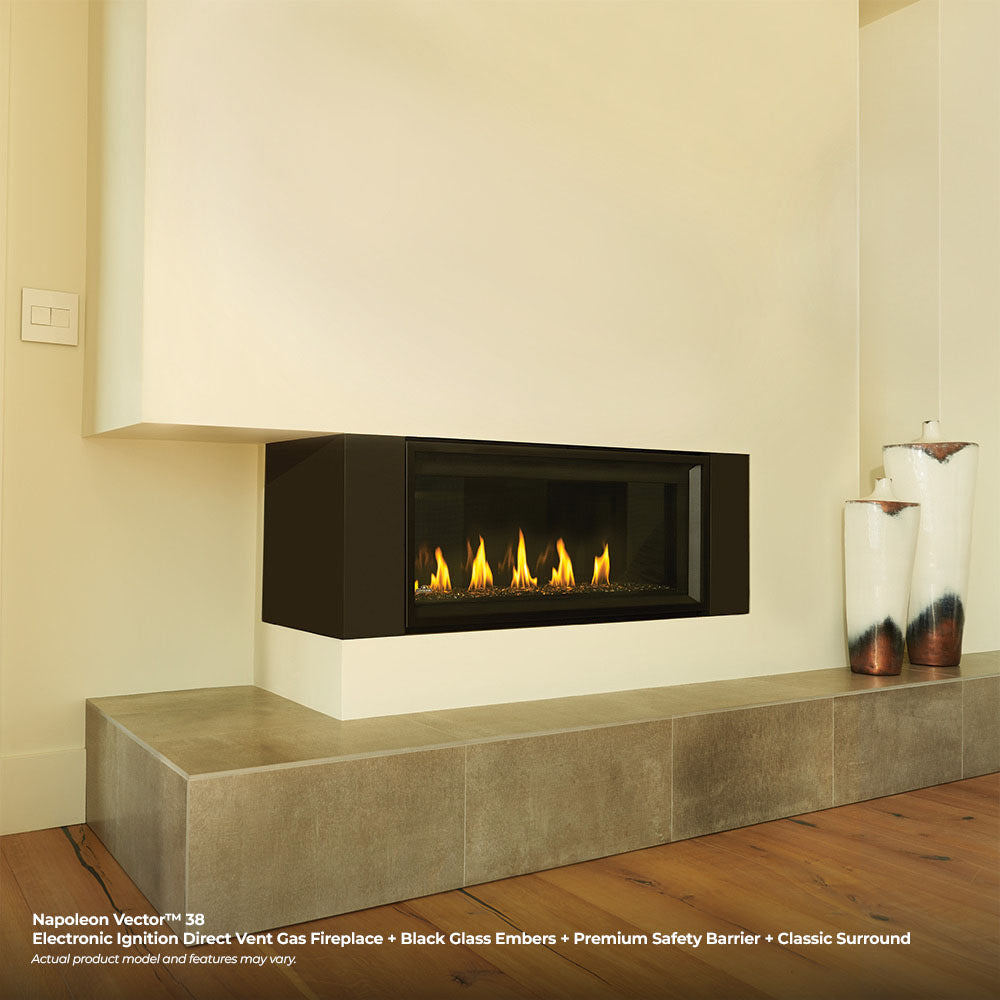 Built-in linear gas fireplace with black glass ember bed and visible flames, surrounding trim
