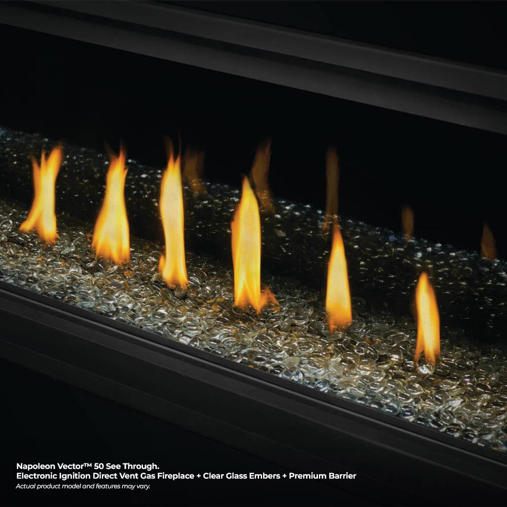 Gas fireplace flames over glass ember bed with premium barrier