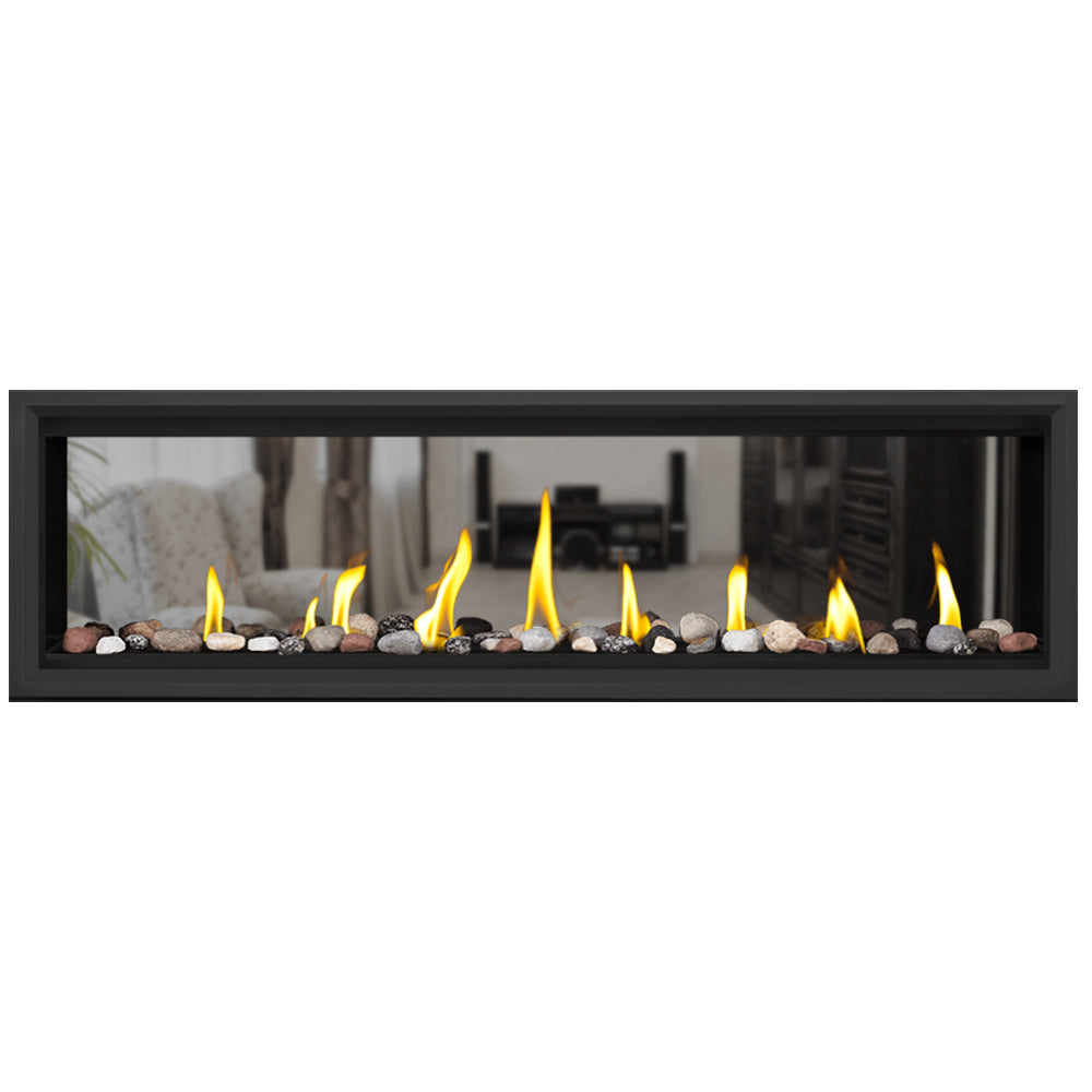 Direct vent gas fireplace with white pebble fire bed and flames