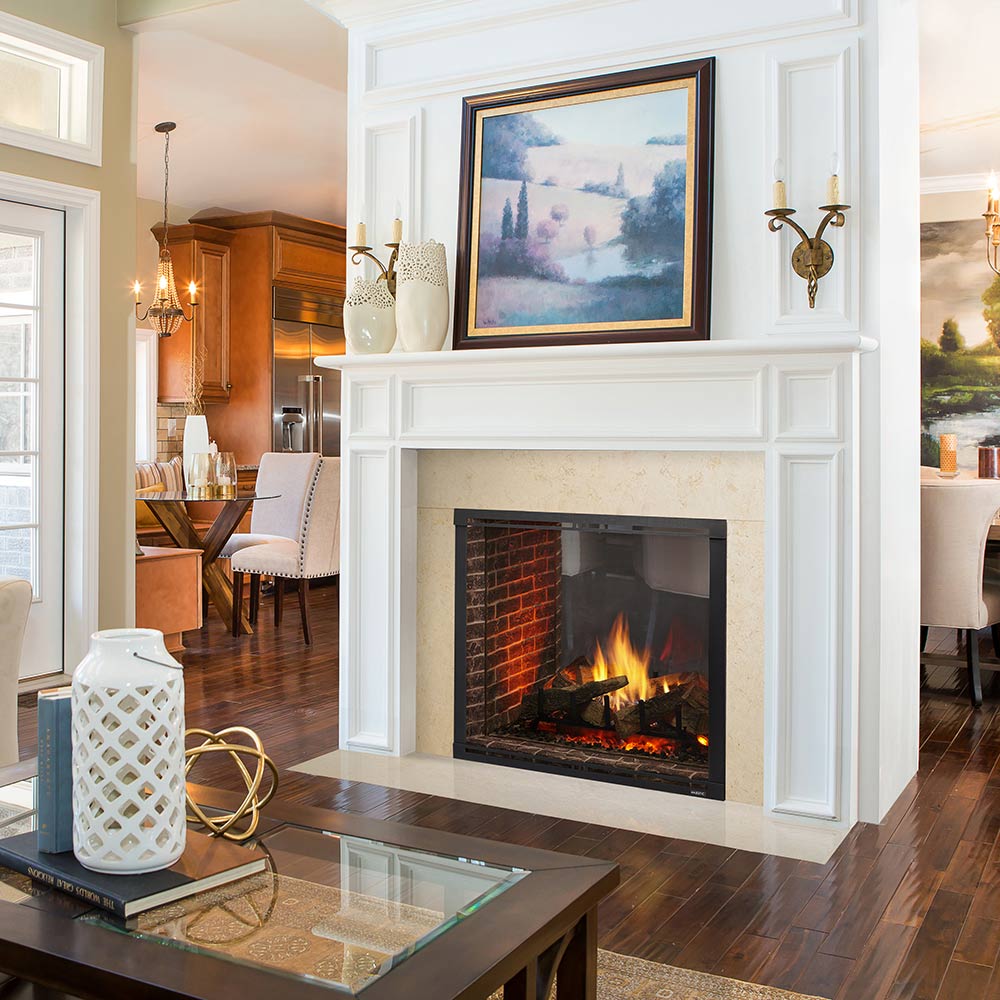 Built-in gas fireplace with dark frame, glass front, and brick interior with flames