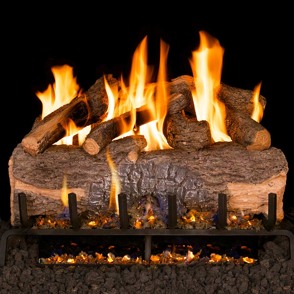 Vented gas log set with oak-style logs and glowing flames in stone surround
