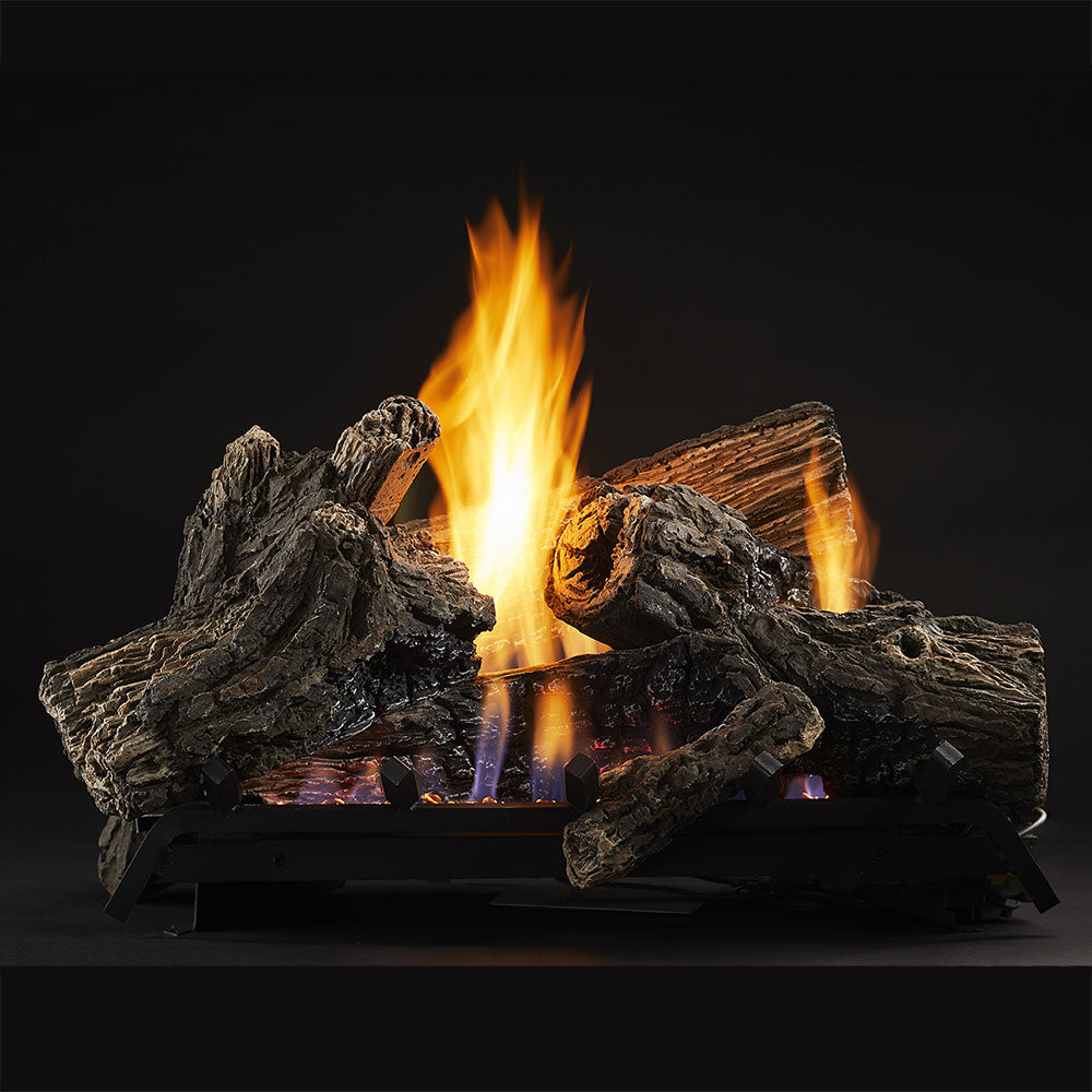 Vent-free gas log set with stacked dark logs and orange flames over ember bed