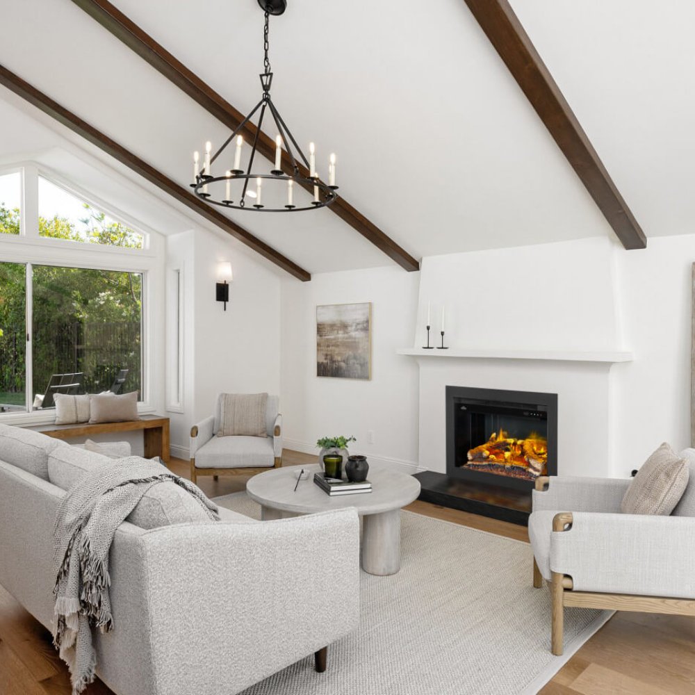 Black electric fireplace insert with lit flame window in a living room
