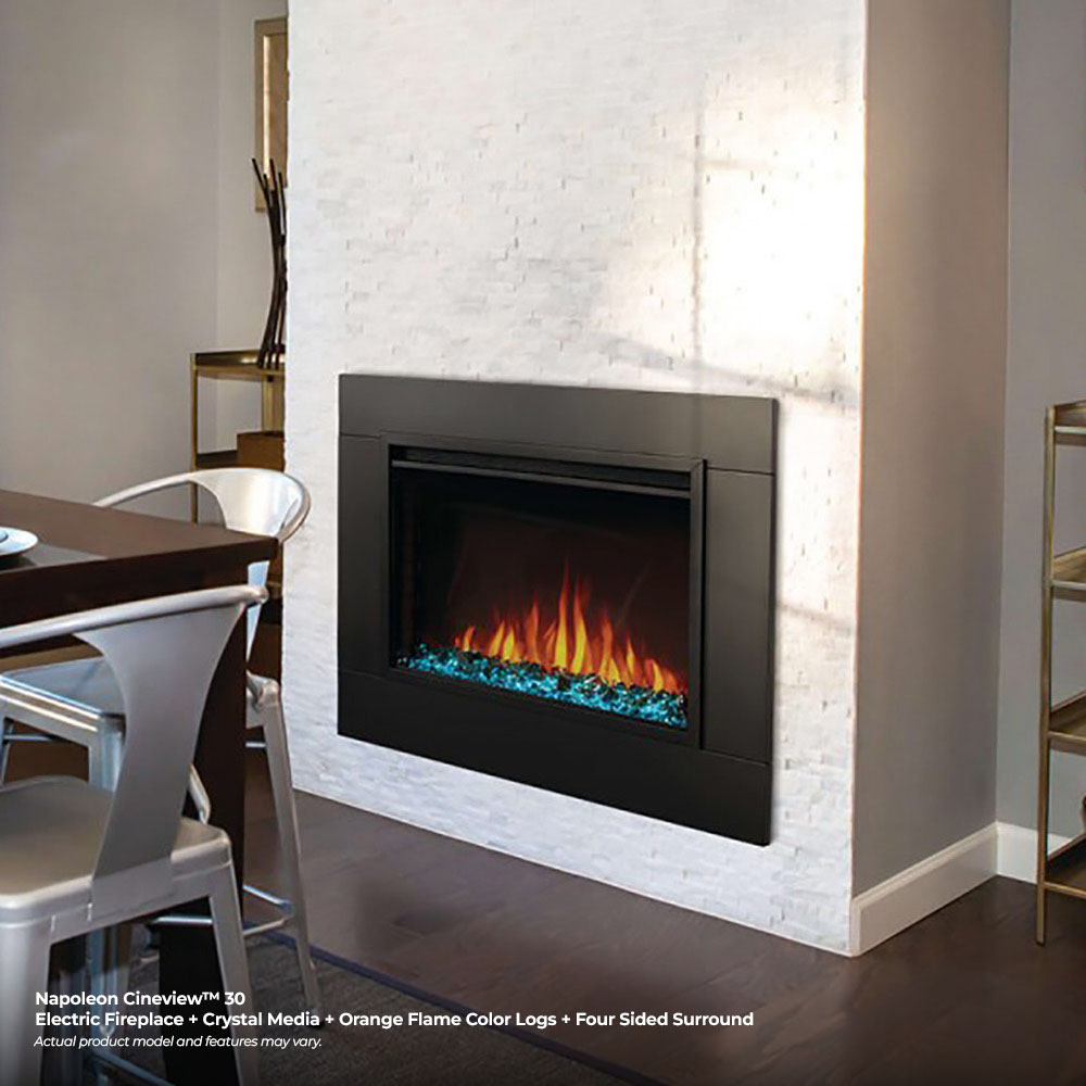 Built-in electric fireplace in wall with glass panel flames and blue crystal base