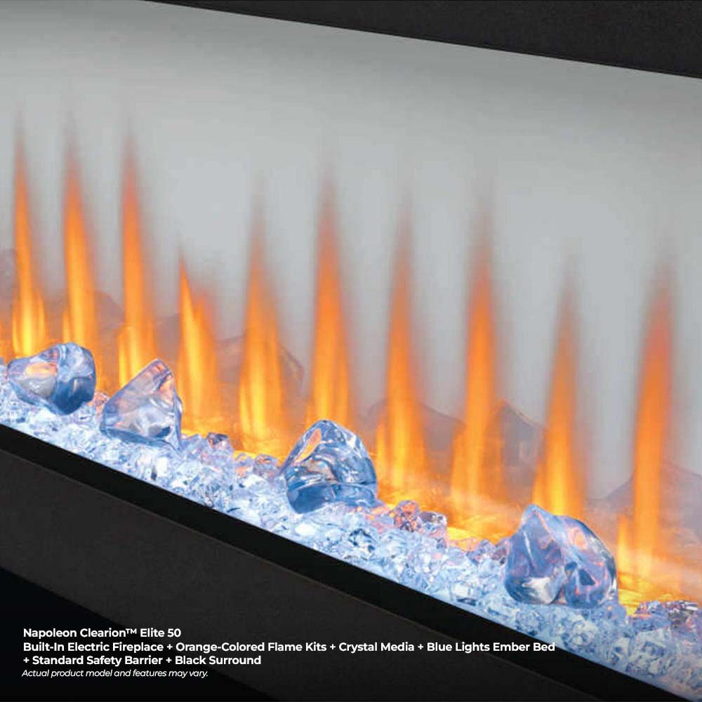 Close-up of electric fireplace flame effect with orange flames over blue crystal media