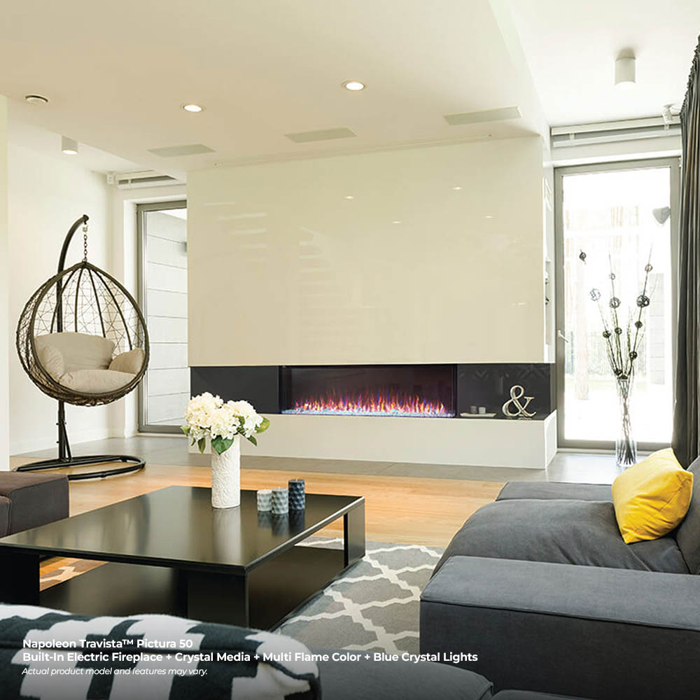 Built-in 3-sided electric fireplace with blue flame glow in a bright living room