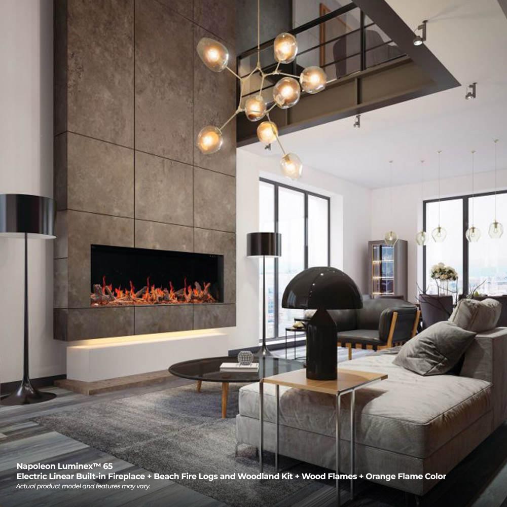 Linear electric fireplace with orange flames set into a stone wall