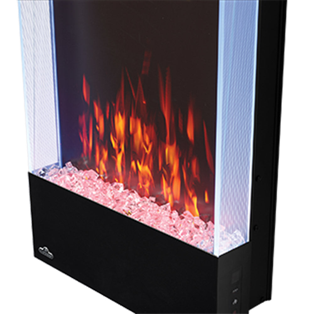 Black electric fireplace with red and orange flames over pink sparkling glass rocks