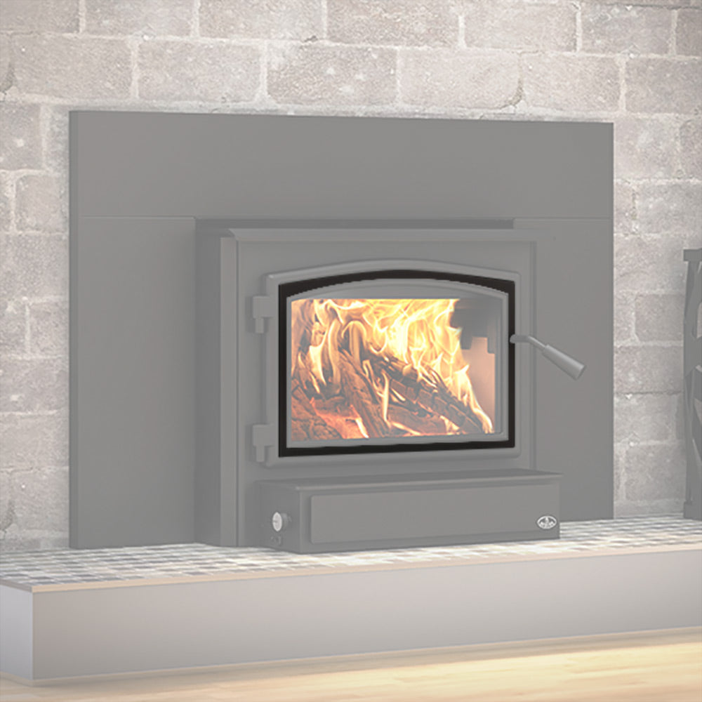 Black wood stove door overlay installed around the glass firebox