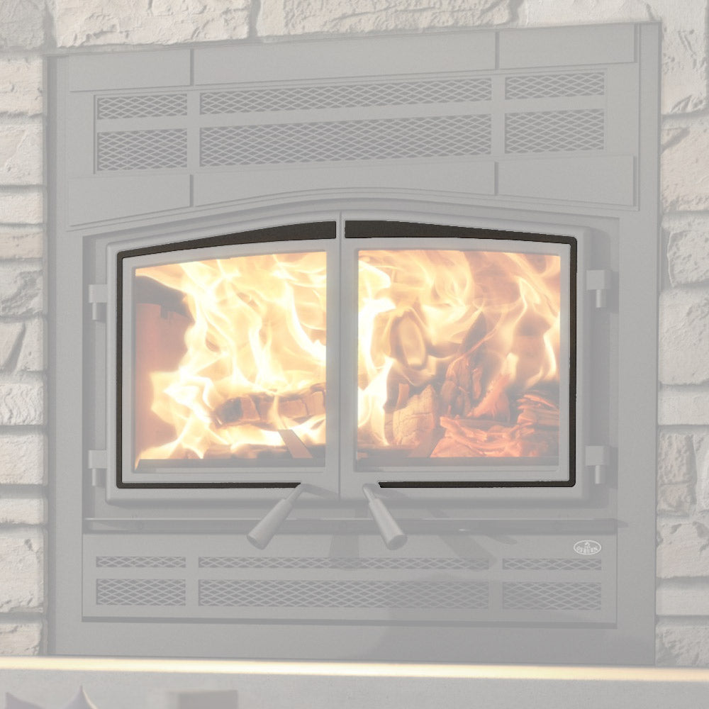 Black fireplace door overlay installed on double-door wood stove with viewing windows