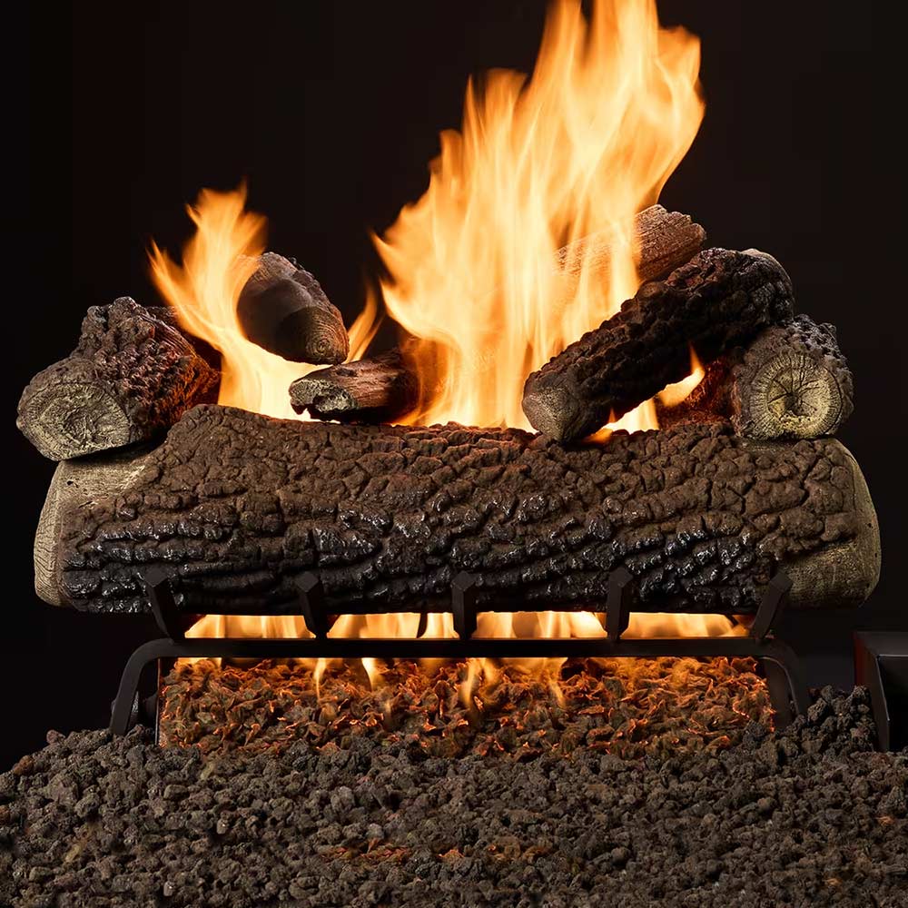 Indoor gas log burner with stacked logs and bright flames