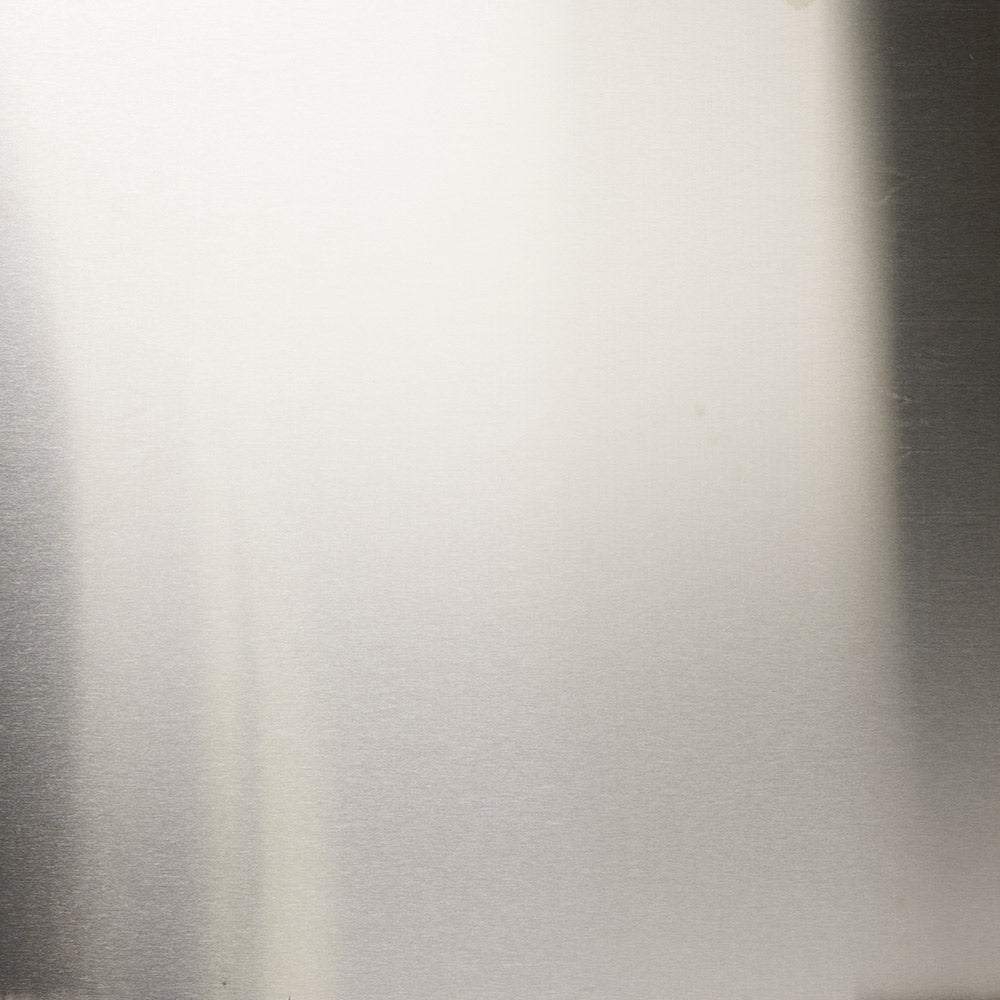 Stainless steel refractory panel with smooth brushed metal finish