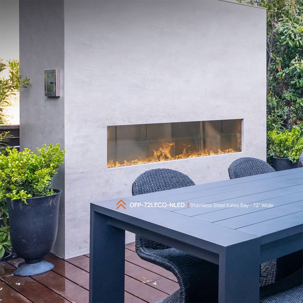 60-inch linear outdoor fireplace with glass front and glowing flames, blue-gray surround