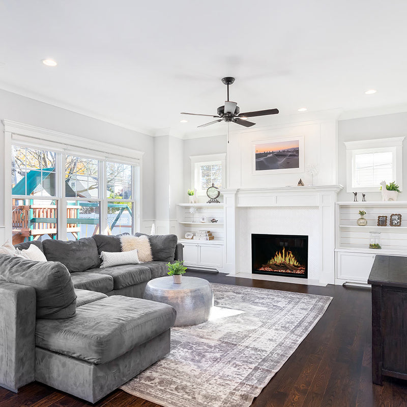 Built-in electric fireplace insert with dark screen and faux flame in living room
