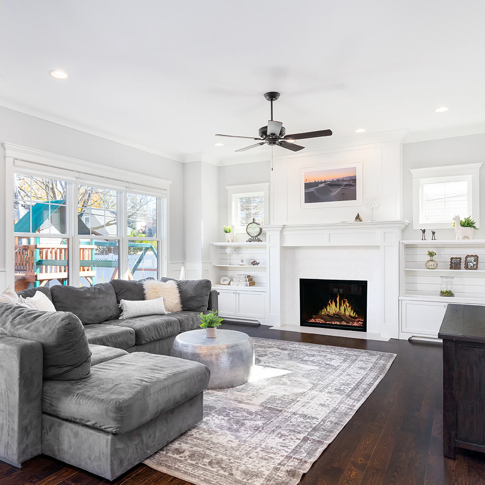 Built-in electric fireplace insert with flame display in a living room