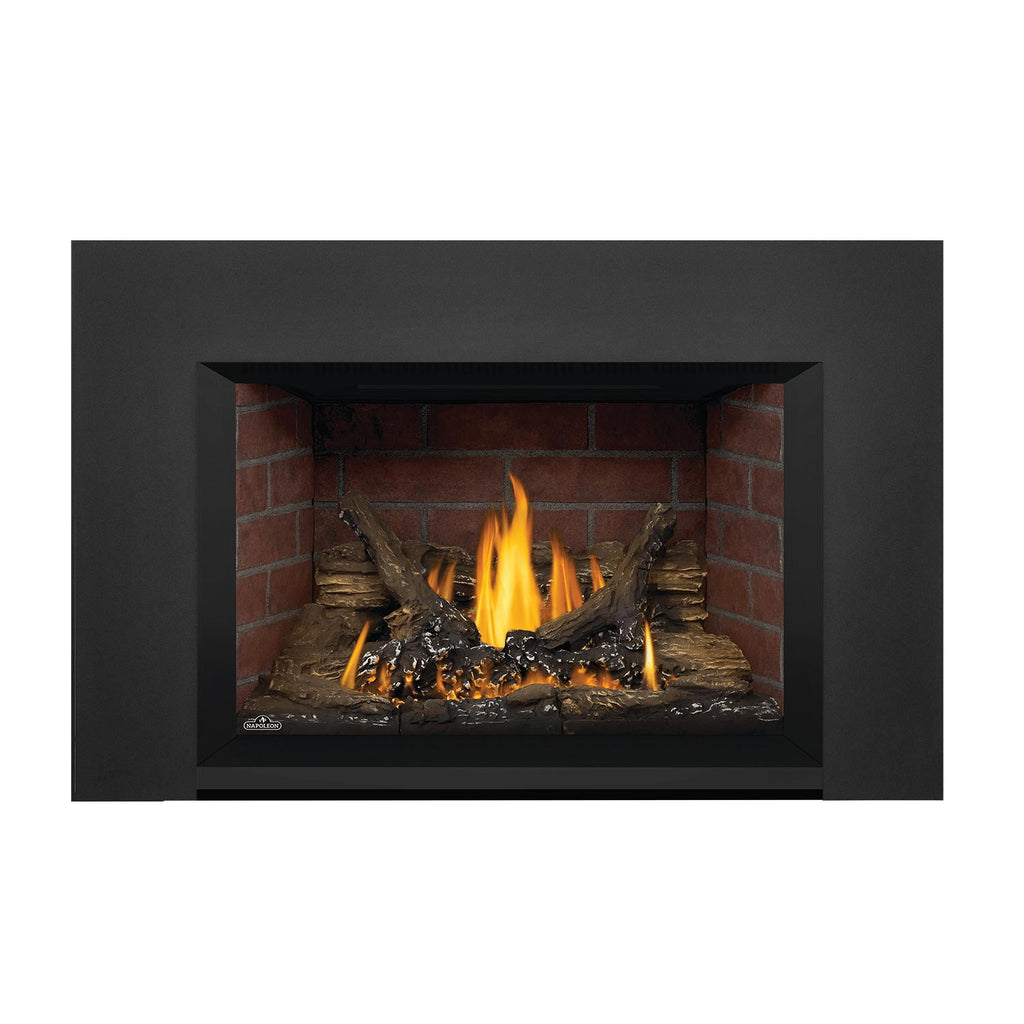 Direct vent gas fireplace insert with dark gray surround and burning flames