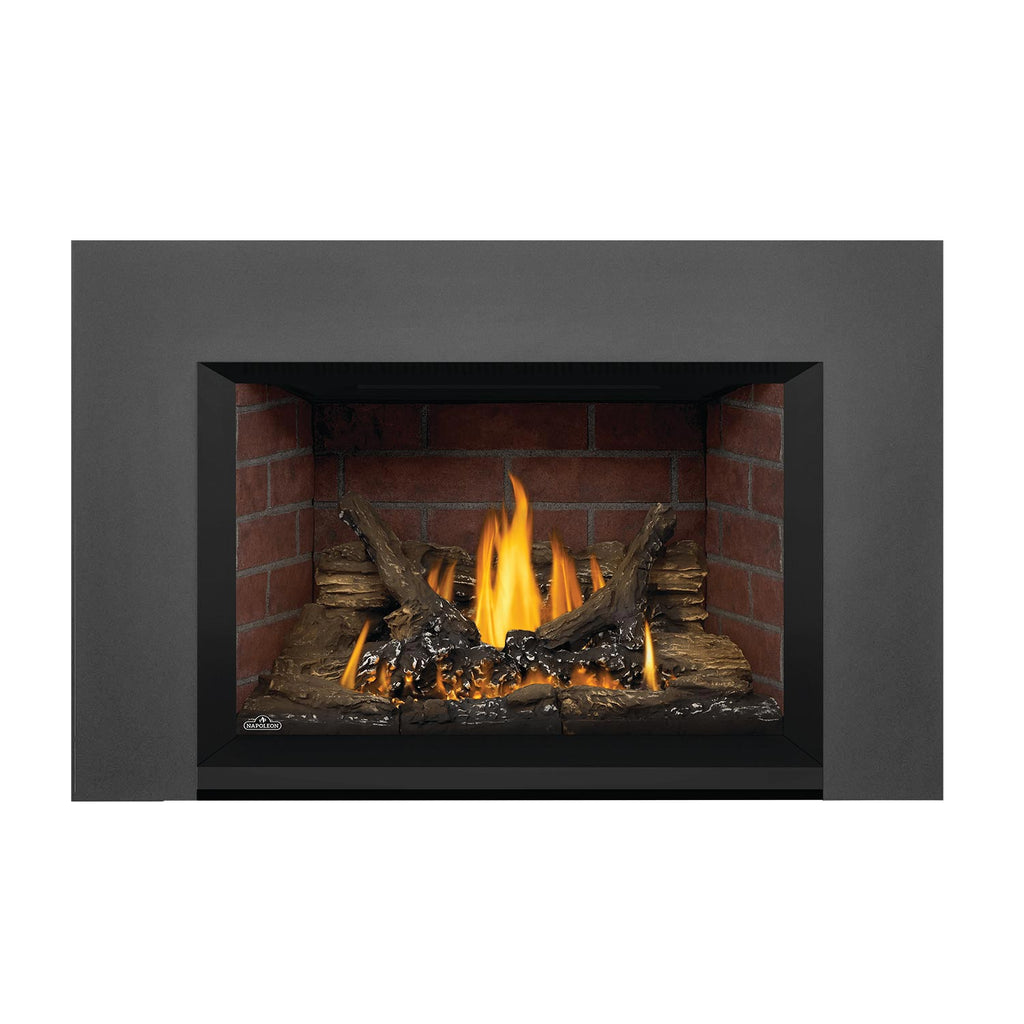 Direct vent gas fireplace insert with dark gray surround and burning flames