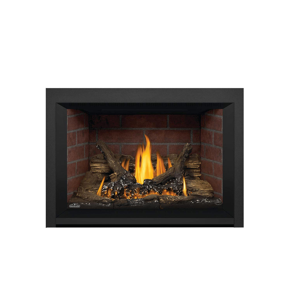 Gas fireplace insert with black trim, brick interior, burning flames, and log set.