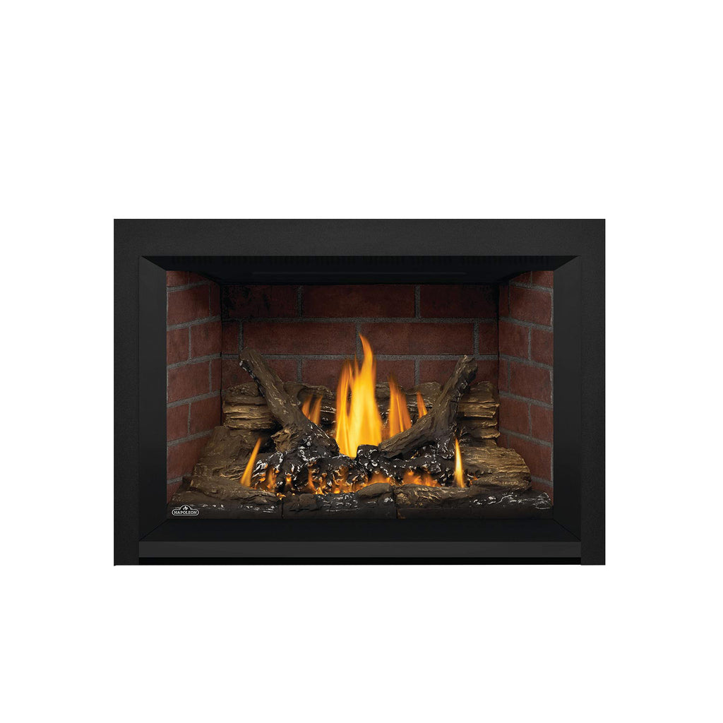 Direct vent gas fireplace insert with dark surround, glowing flames, and log firebed