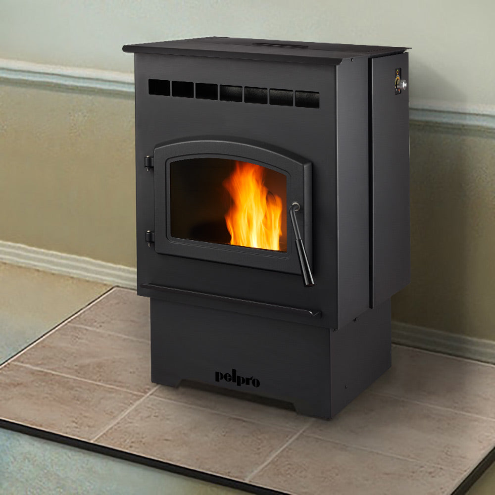 Black pellet stove standing on tile flooring with fire in the viewing window