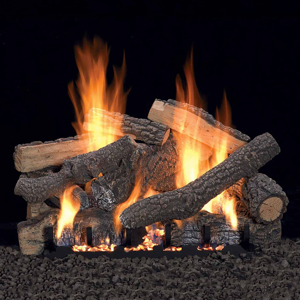 Vented refractory fireplace log set with glowing flames and dark split logs
