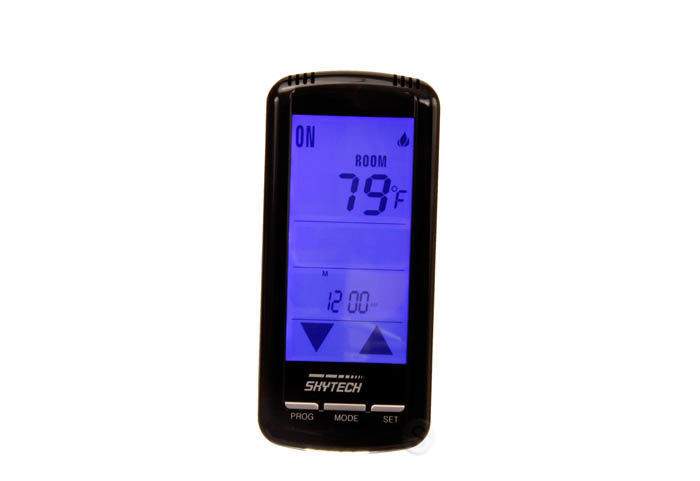 Handheld Skytech programmable fireplace remote with backlit touch screen and temperature display