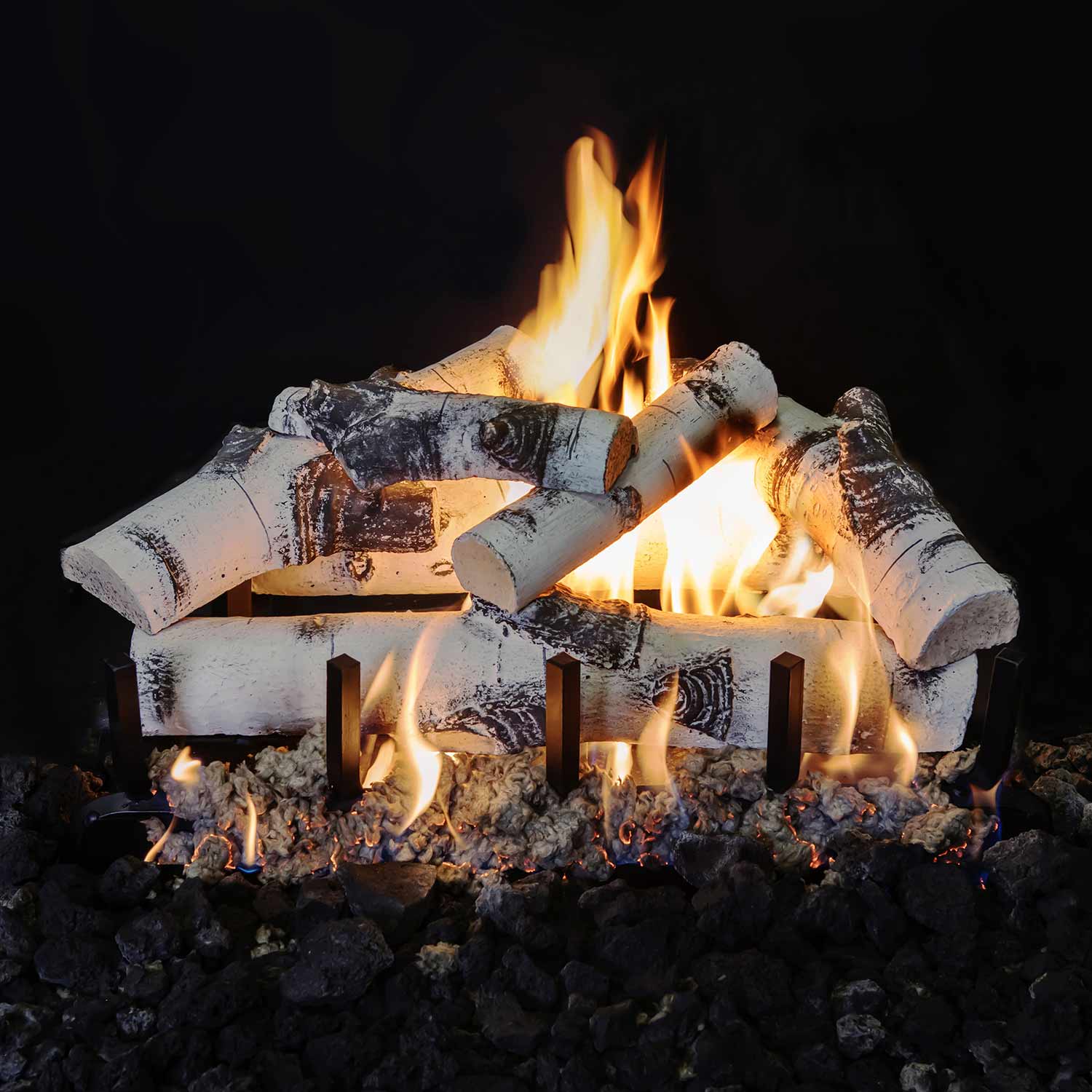 Gas fire logs with stacked white wood rounds, dark char accents, and multiple flames