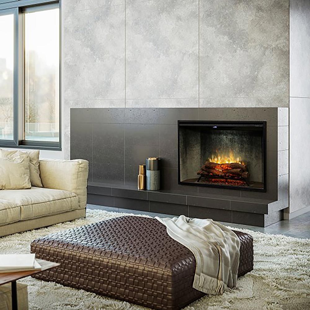 Electric fireplace with dark mantel, glass front, and glowing log bed