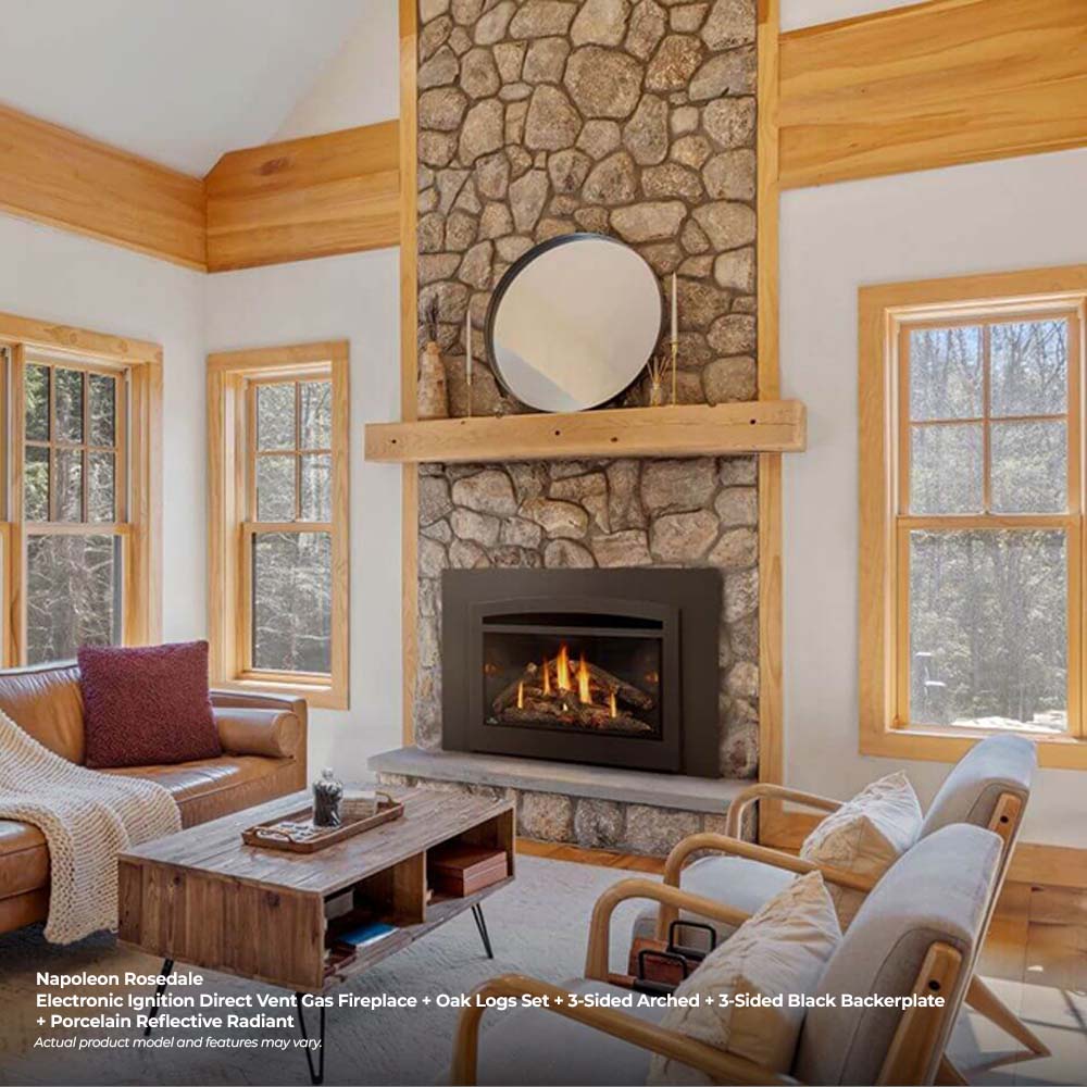 Direct vent gas insert fireplace with burning logs and black surround in a stone hearth