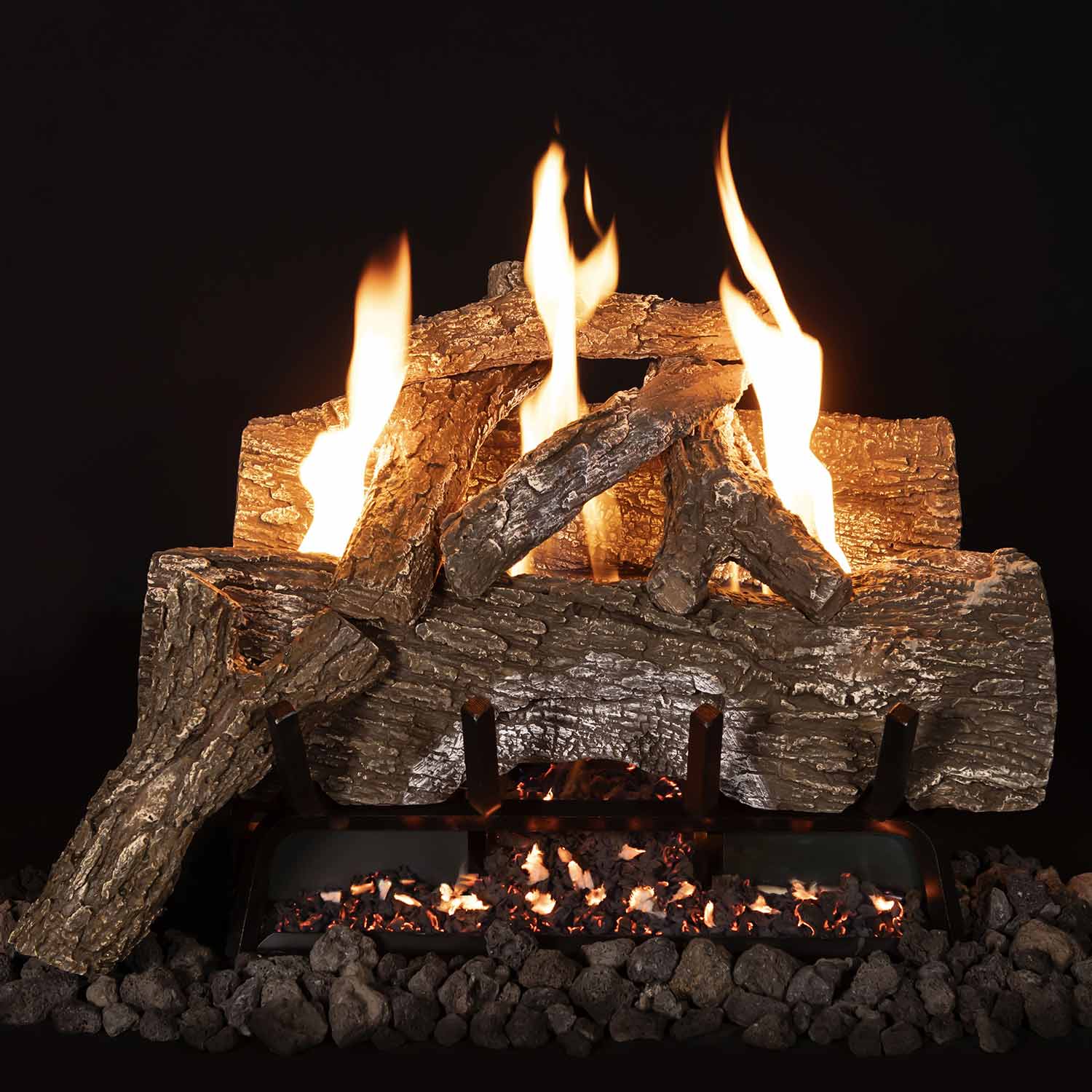 Vent free gas log set with split logs and four visible flames over a rock bed