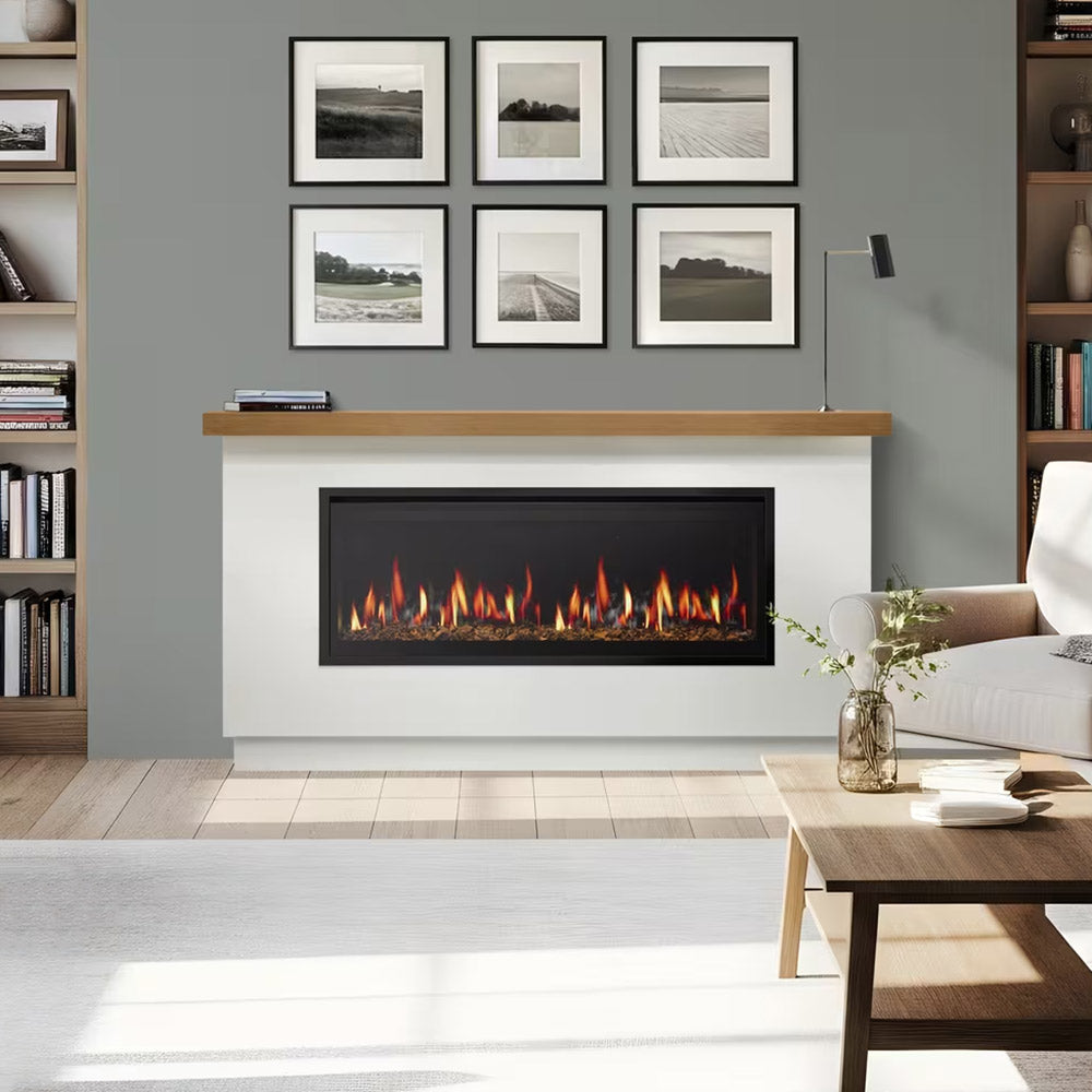 White electric fireplace mantel with black recessed firebox, burning flame view, wood shelf