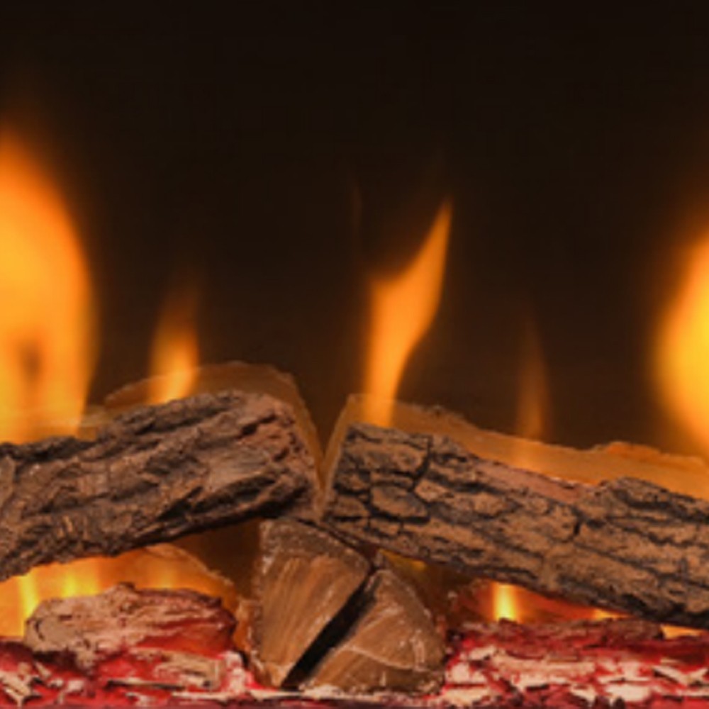Close-up molded logs in an electric fireplace with glowing orange flame light