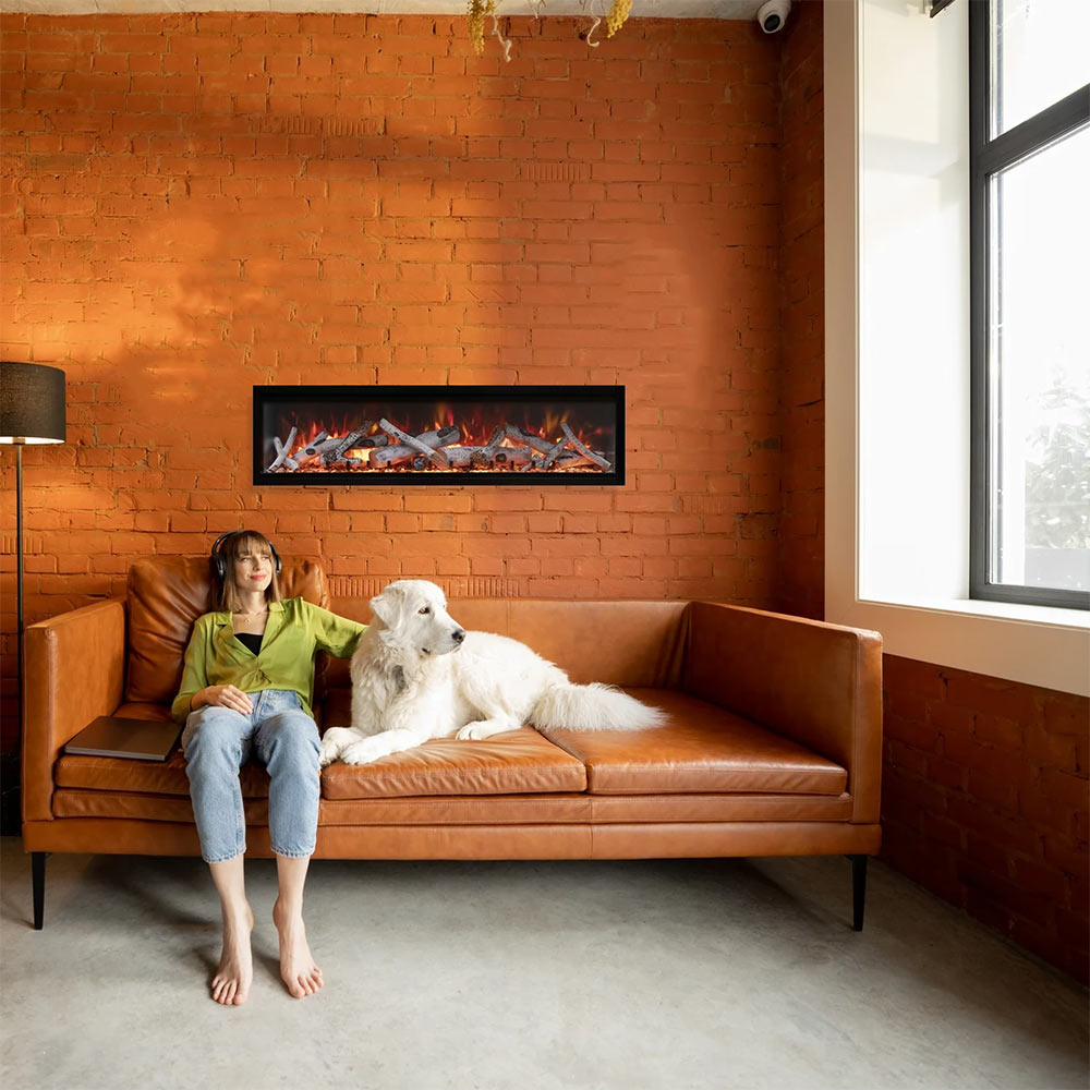 Built-in electric fireplace with black frame and burning logs mounted on brick